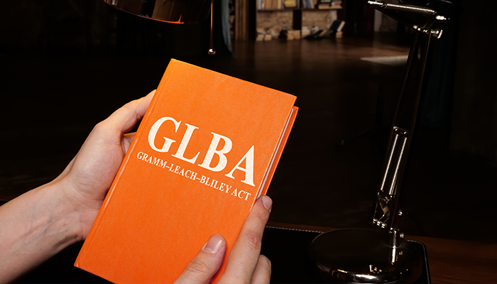 hands holding GLBA book