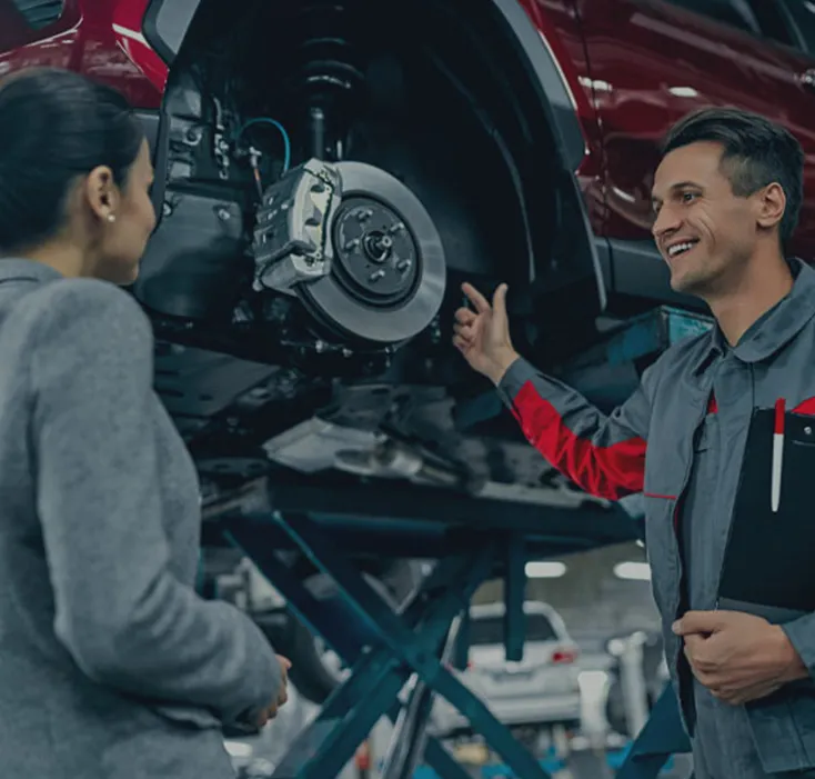 Mechanic talking to customer